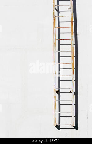 simple metal ladder on cement wall, architectural background　 Stock Photo