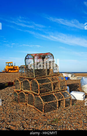 Crab pots stacked on the shingle beach at Cley next the Sea, Norfolk, England, United Kingdom. BHZ. Stock Photo