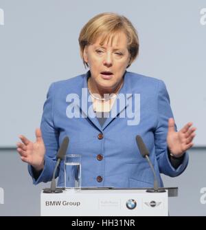 German Chancellor Angela Merkel delivers a speech on the expansion of the plant of German carmaker BMW in Leipzig, Germany, 05 November 2010. BMW expands its Leipzig plant for the production of newly-developped Megacity Vehicle. The zero-emission vehicle featuring an extremly light plastic body is to be produced in Leipzig from 2013 on. BMW head Reithofer and German Chancellor Merkel symbolically kicked off the construction works for the expansion. According to Reithofer, BMW invests some 400 million euro and creates some 800 jobs. Photo: PETER ENDIG | usage worldwide Stock Photo