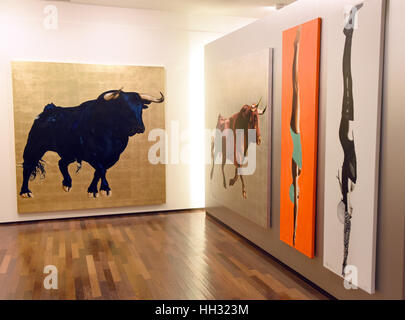 Pictures of bulls and women by German-Polish painter Adam Pete on show at the exhibition of his work titled 'Girls and Bulls' at Galerie Mensing in Duesseldorf, Germany, 15 Janaury 2017. The artist lives and works on the Spanish island of Majorca. Photo: Horst Ossinger//dpa Stock Photo