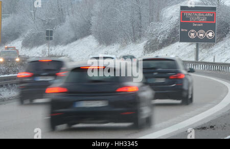 A sign indicates Feinstaubalarm (lit. fine particle warning) in Stuttgart, Germany, 16 Janaury 2017. In contrast to rain, snow does little to clear the atmosphere of fine particles. Photo: Franziska Kraufmann/dpa Stock Photo