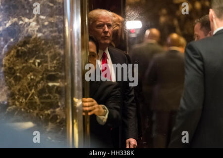 New York, Us. 13th Jan, 2017. President-elect Donald Trump is seen leaving the lobby of Trump Tower in New York, NY, USA on January 13, 2017. Credit: Albin Lohr-Jones/Pool via CNP - NO WIRE SERVICE - Photo: Albin Lohr-Jones/Consolidated/dpa/Alamy Live News Stock Photo