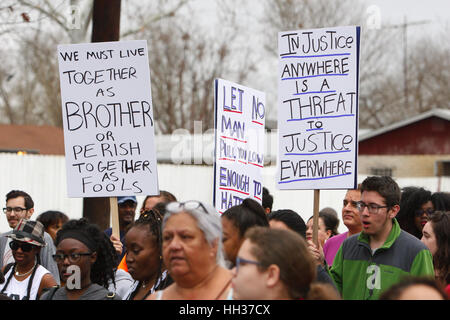 San Antonio, USA. 16th January, 2017. Marchers holding signs during the annual Martin Luther King Jr. march in San Antonio, Texas. Several thousand people attended the city's 30th anniversary march celebrating U.S. civil rights leader Martin Luther King, Jr. Credit: Michael Silver/Alamy Live News Stock Photo
