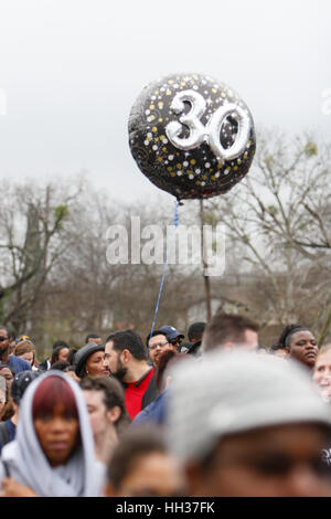 San Antonio, USA. 16th January, 2017. A balloon carried by a marcher emphasizes the 30th anniversary of the annual Martin Luther King Jr. march in San Antonio, Texas. Several thousand people attended the city's 30th anniversary march celebrating U.S. civil rights leader Martin Luther King, Jr. Credit: Michael Silver/Alamy Live News Stock Photo