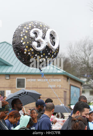 San Antonio, USA. 16th January, 2017. A balloon carried by a marcher emphasizes the 30th anniversary of the annual Martin Luther King Jr. march in San Antonio, Texas. Several thousand people attended the city's 30th anniversary march celebrating U.S. civil rights leader Martin Luther King, Jr. Credit: Michael Silver/Alamy Live News Stock Photo