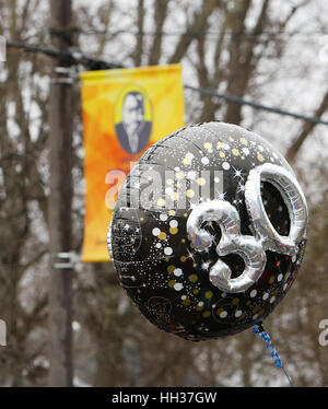 San Antonio, USA. 16th January, 2017. A balloon carried by a marcher emphasizes the 30th anniversary of the annual Martin Luther King Jr. march in San Antonio, Texas. Several thousand people attended the city's 30th anniversary march celebrating U.S. civil rights leader Martin Luther King, Jr. Credit: Michael Silver/Alamy Live News Stock Photo