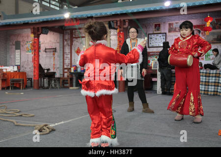 Xi'an, China. 15th January, 2017. **EDITORIAL USE ONLY. CHINA OUT** The Italian girl Gemma wearing Chinese traditional clothes experiences folk customs of Spring Festival with her Chinese friends in Xi'an, capital of northwest China's Shaanxi Province. Gemma now lives in Xi'an with her parents because of their jobs there. Credit: SIPA Asia/ZUMA Wire/Alamy Live News Stock Photo