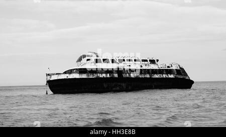 A Ferry near Isla Cozumel in Quintana Roo, Mexico beach; Showing the deterioration by the passage of time and abandonment of its Stock Photo