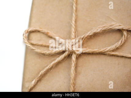 rope with a bow on the box kraft paper Stock Photo