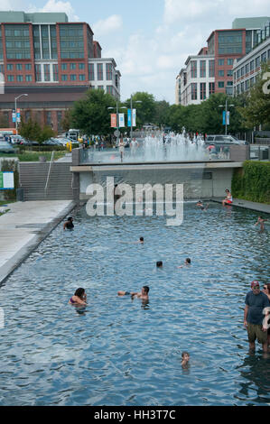 People are splashing in pool at Yards Park, a scenic park with a riverfront boardwalk in the summer in Washington, DC Stock Photo