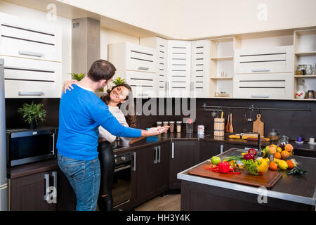 Young couple having fun in the kitchen Stock Photo