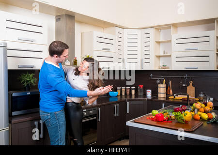 Young couple having fun in the kitchen Stock Photo