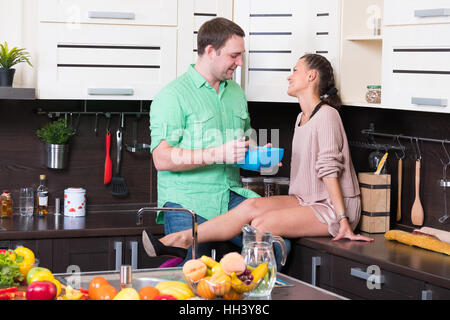 Young couple having fun in the kitchen Stock Photo