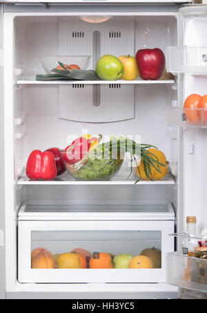 Open fridge with fruits and vegetable Stock Photo