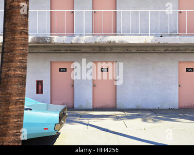 Luggage beside parked car outside motel. 3d rendering Stock Photo