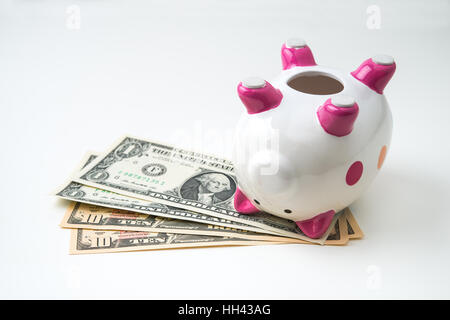 dead piggy bank with money Stock Photo