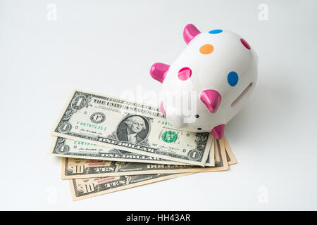 dead piggy bank with money Stock Photo