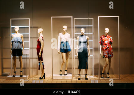 Female mannequins standing in store window display of women casual clothing  shop in shopping mall Stock Photo - Alamy