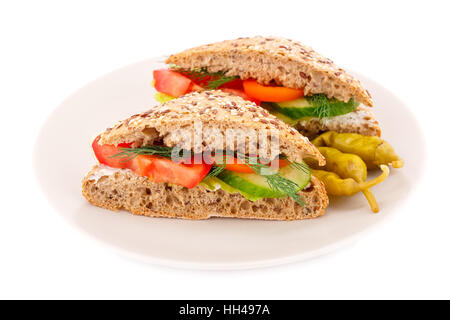 Sandwiches with fresh vegetables and cheese on plate. Stock Photo