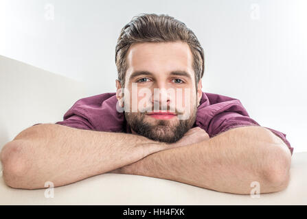 Close-up portrait of handsome bearded man looking at camera Stock Photo