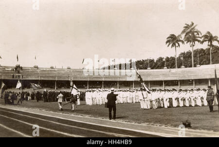 Royal Navy personnel from the warships HMS Hood and HMS Repulse at the Laranjeiras Stadium (football ground of Fluminense FC), Rio de Janeiro, Brazil. They were there for the Goodwill Olympics, September 1922. Also participating were personnel of the Amer