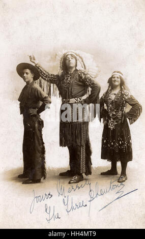 Three people in Cowboy and Indian costume in studio photo Stock Photo
