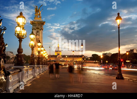 View on Les Invalides from bridge Alexandre III in Paris at sunset, France Stock Photo