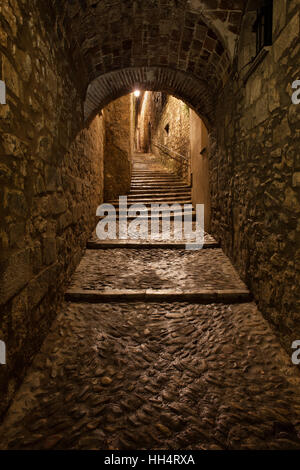 City of Girona in Catalonia, Spain, Sant Llorenc street at night, medieval passage with stairs in Old Quarter - Barri Vell Stock Photo