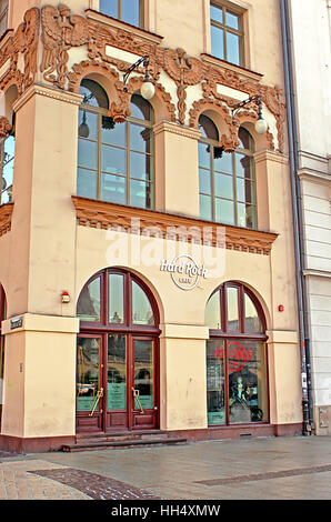 KRAKOW, POLAND - JANUARY 04, 2011: Hard Rock Cafe in Krakow is located in the UNESCO World Heritage Market Square, next door to the most famous church Stock Photo