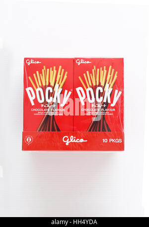 Close up of Pocky Chocolate flavour covered biscuit isolated against white background Stock Photo