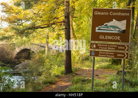 Glencoe - Gleann Comhann', sign in english and gaelic at the entrance to Glencoe village, Glen Coe, Scotland, UK Stock Photo