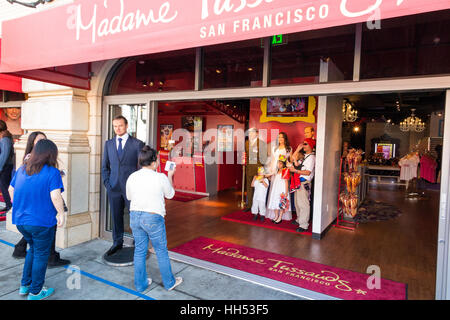 People taking photographs of their firends / family members at the front of the Madame Tussauds wax museum Stock Photo