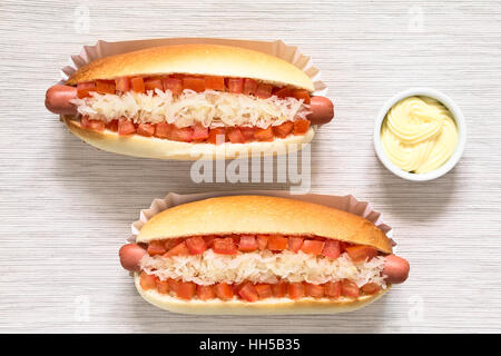 Chilean Completo Clasico (classical) or Aleman (German) traditional hot dog sandwiches with tomato and sauerkraut Stock Photo