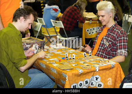 People playing table game at the Gamefilmexpo festival Stock Photo