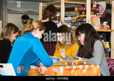 People playing table game at the Gamefilmexpo festival Stock Photo