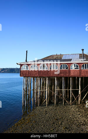 CASTRO, CHILE - FEBRUARY 6, 2016: Brisas del Mar Restaurant located in a traditional red wooden palafito building on stilt Stock Photo