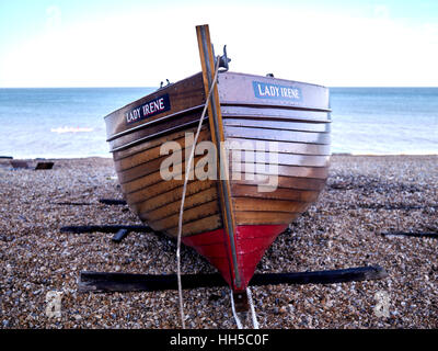 Clinker Fishing Boat hauled up on the shingle, Deal Beach, Kent UK Stock Photo