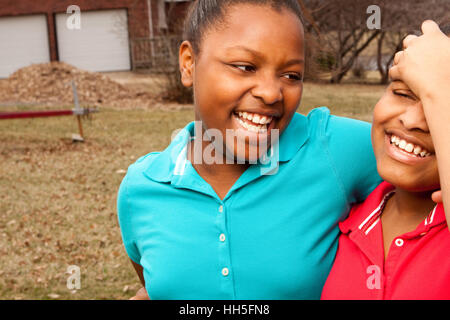 African American sisters and best friends laughing. Stock Photo