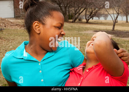 African American sisters and best friends laughing. Stock Photo