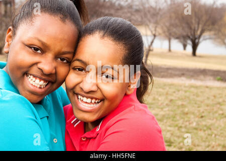 African American sisters and best friends laughing. Stock Photo