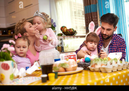 Parents and three girls before the Easter Stock Photo