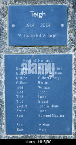 A plaque in the village of Teigh, Rutland, England, commemorating 100 years (1914-2014) as a 'Thankful Village' with a role of honour below. Stock Photo