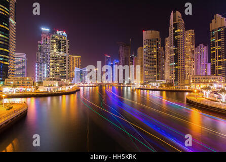 Modern skyscrapers in luxury Dubai Marina with busy promenade in the evening,Dubai,United Arab Emirates