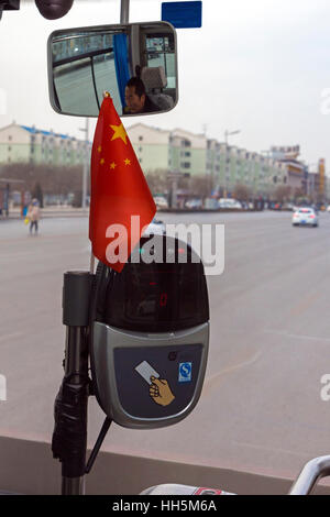 Automatic fare reader for swipe card and view from bus window, Yinchuan, Ningxia province, China Stock Photo