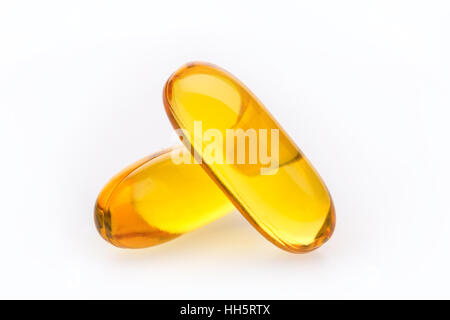 Cod Liver Oil capsules against a white background Stock Photo