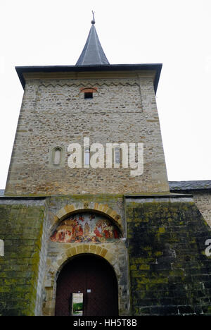 The Sucevita Monastery is a Romanian Orthodox monastery situated in the  Suceava County, Moldavia, Bucovina, Romania. The monastery  was built in 1585 by Ieremia Movila, Gheorghe Movilă and Simion Movila. It is one of the eight monasteries in Northern Moldavia with frescoes painted on the outer walls. The interior court of the monastic ensemble is almost square and is surrounded by high (6 m), wide (3 m) walls.There are several other defensive structures within the ensemble, including four towers (one in each corner).Sucevița was a princely residence as well as a fortified monastery. Entrance. Stock Photo