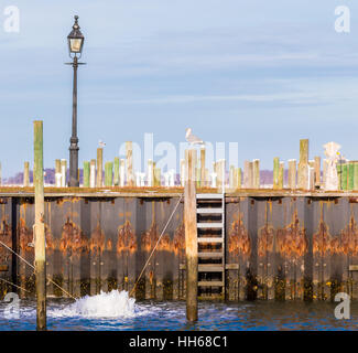 an image of a bubbler, de-icer, circulator, aerator at work in a marina, protecting docks in a marine enviorment Stock Photo