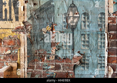 Vintage textures: old wallpaper, peeling paint, brick wall and layers of different colorful backgrounds. Stock Photo