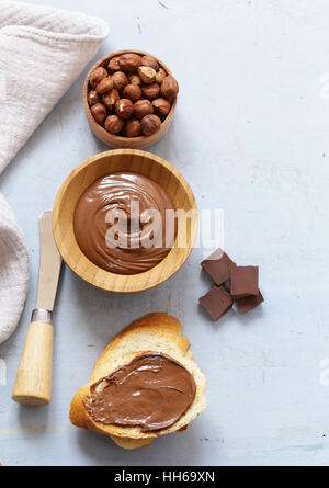 Chocolate paste spread with hazelnuts and bread for breakfast Stock Photo