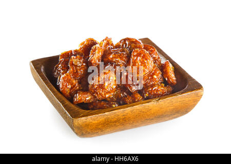 Dried fruit Physalis peruviana in wooden bowl isolated on white background Stock Photo
